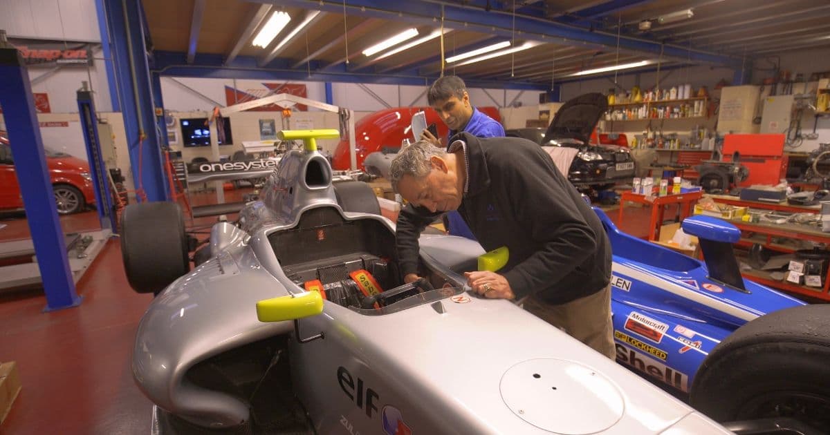 Jim Campbell OBE Inspecting Motorcar 